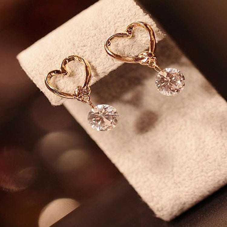 2 pendientes elegantes con diseño de corazón de cristal para mujer.